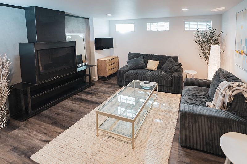 The coziest living room! Beautiful fireplace, RokuTV, comfy, soft couches in the living room.
