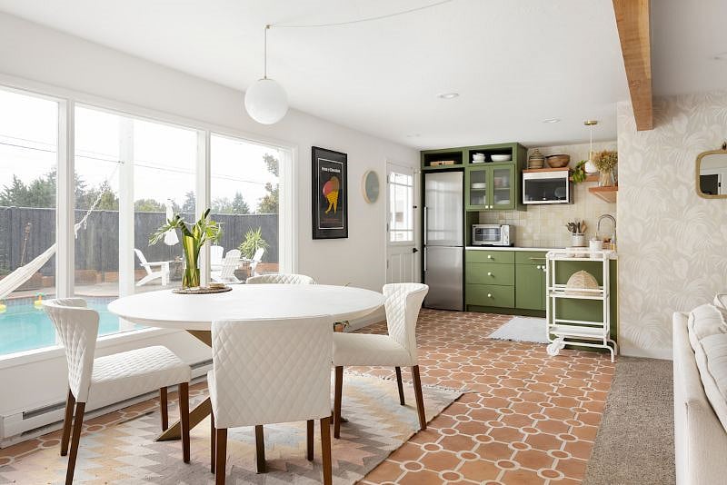 Dining area and kitchen overlooking the backyard & pool