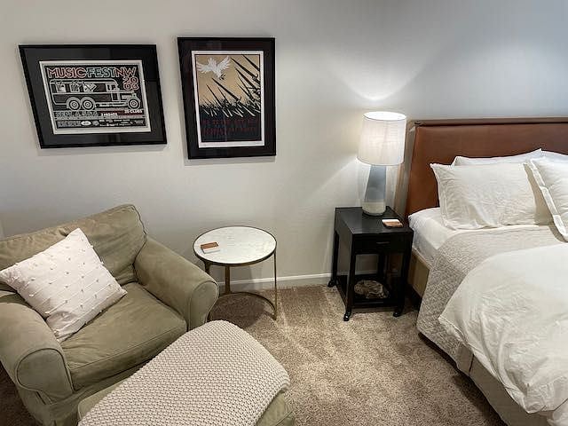 Primary bedroom is large, light and bright. Features a king-sized bed, desk, closet, dresser, lounge area and TV with Roku 4k+ streaming device.