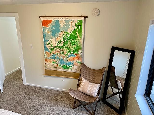 2nd bedroom features queen sized bed, closet, dresser, lounge chair. Access to utility area with washer & dryer as well. (not pictured)