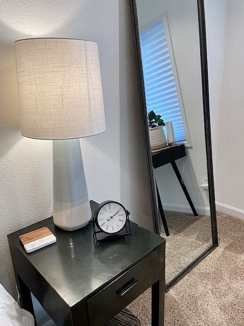 Primary bedroom is large, light and bright. Features a king-sized bed, desk, closet, dresser, lounge area and TV with Roku 4k+ streaming device.
