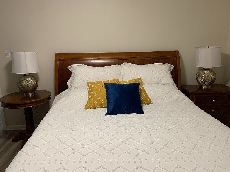 Comfortable King size bed with nightstands & good lighting