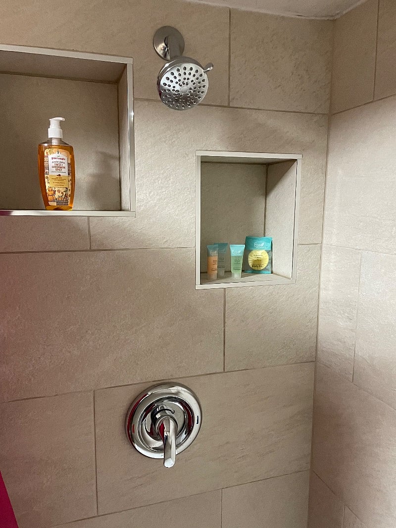 Bathroom with newly redone walk-in shower along with other essentials