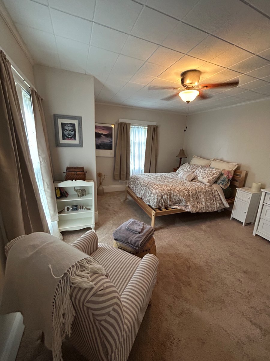 Master bedroom with ensuite bathroom with tub/shower, closet, and two bureaus 