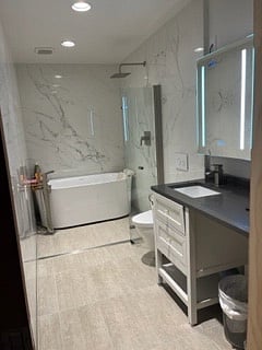 This "Wet Room" is designed for a Japanese style "Ofuro" style bath enjoyment.