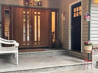 Separate entry on covered porch with a lovely view of the forrest.