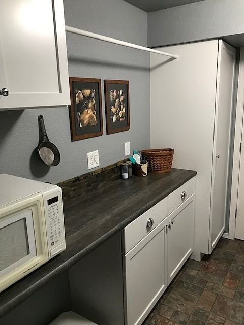Full kitchenette, including microwave, under counter refrigerator and freezer, toaster, new induction cooktop with cookware, coffee maker, pantry, and all kitchen equipment to cook anything you like! [except bake!]