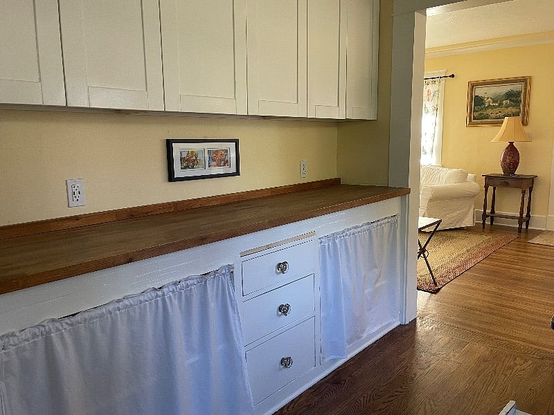 Built in kitchen sideboard across from dining nook. Outlets have USB charging ports.