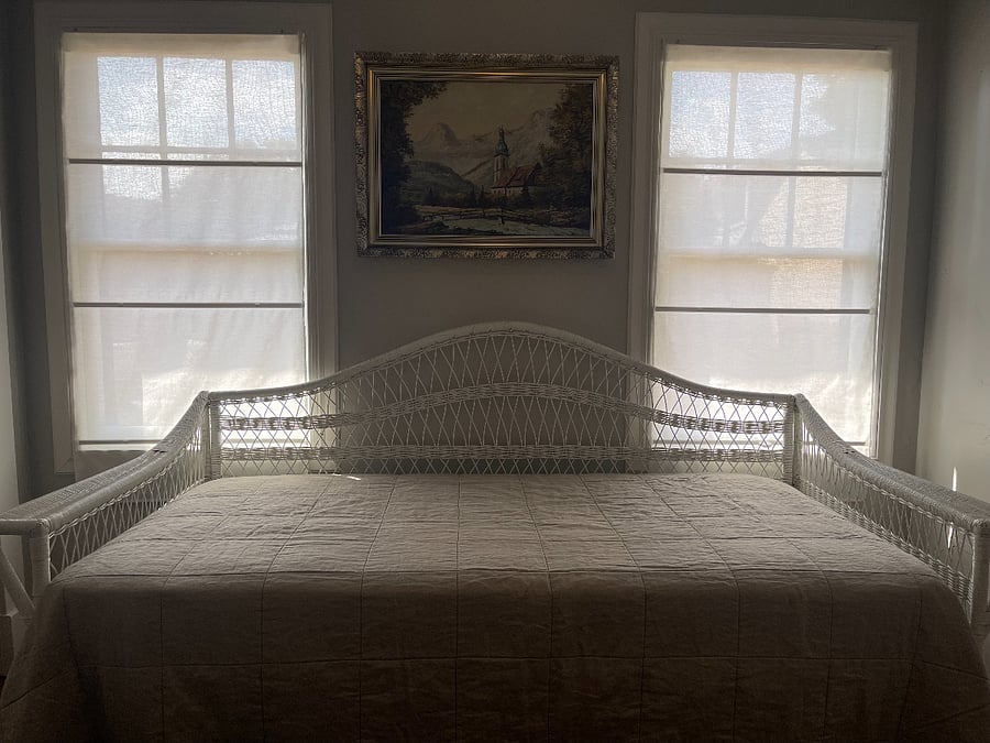 Guest bedroom looks out into the back yard and has a daybed with trundle.