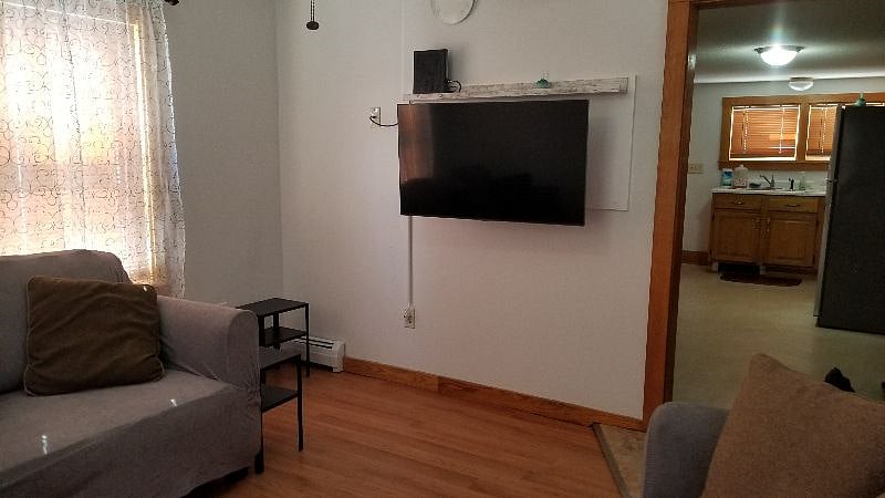 living room with kitchen in the background