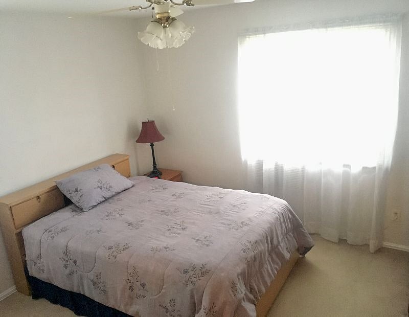 Main floor bedroom with full size bed and 32' Smart TV
