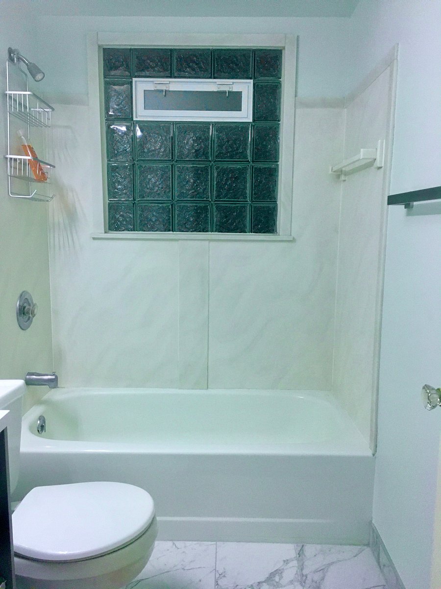 Updated Main Bathroom with bathtub, fresh linens and starter toiletries. Entrance view