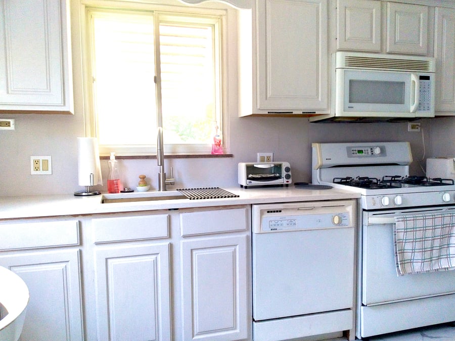 A fully-stocked kitchen with everything you need including cookware, dishes, coffee makers, and blender