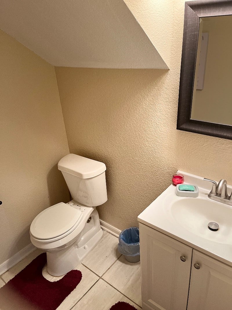 down stairs half bathroom right outside of downstairs living room.