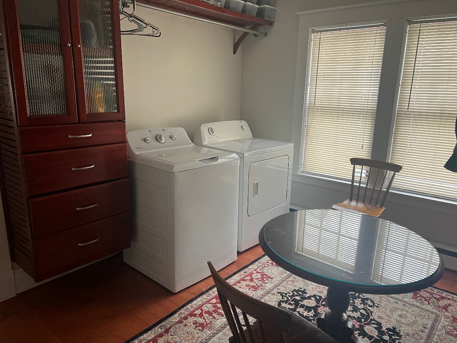 Shared laundry room with table reserved for renter