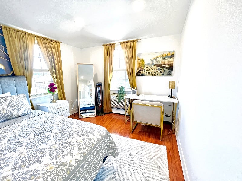 1st bedroom with king size bed and a office/study space