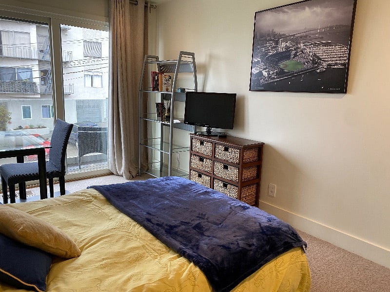 BR 1: Queen Bed (new), desk w monitor for streaming, BALCONY with City View, dresser & closet