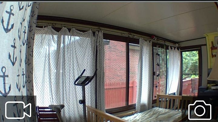 Nautical themed patio sunroom with single bed, deep seat wood chairs with cushions. Nice hangout for humans and pets to chill.