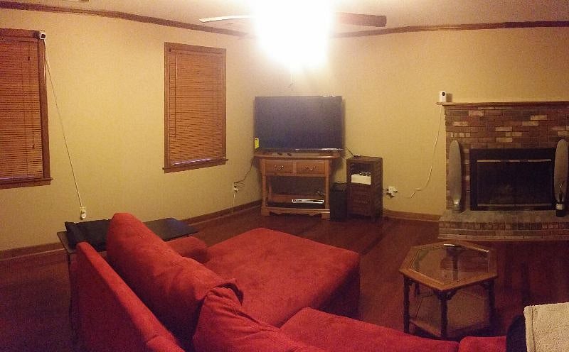 Living room with new  55 in TV with jailbroken firestick with KODI (all TV series and movies via one app) and dvd player also base speaker.