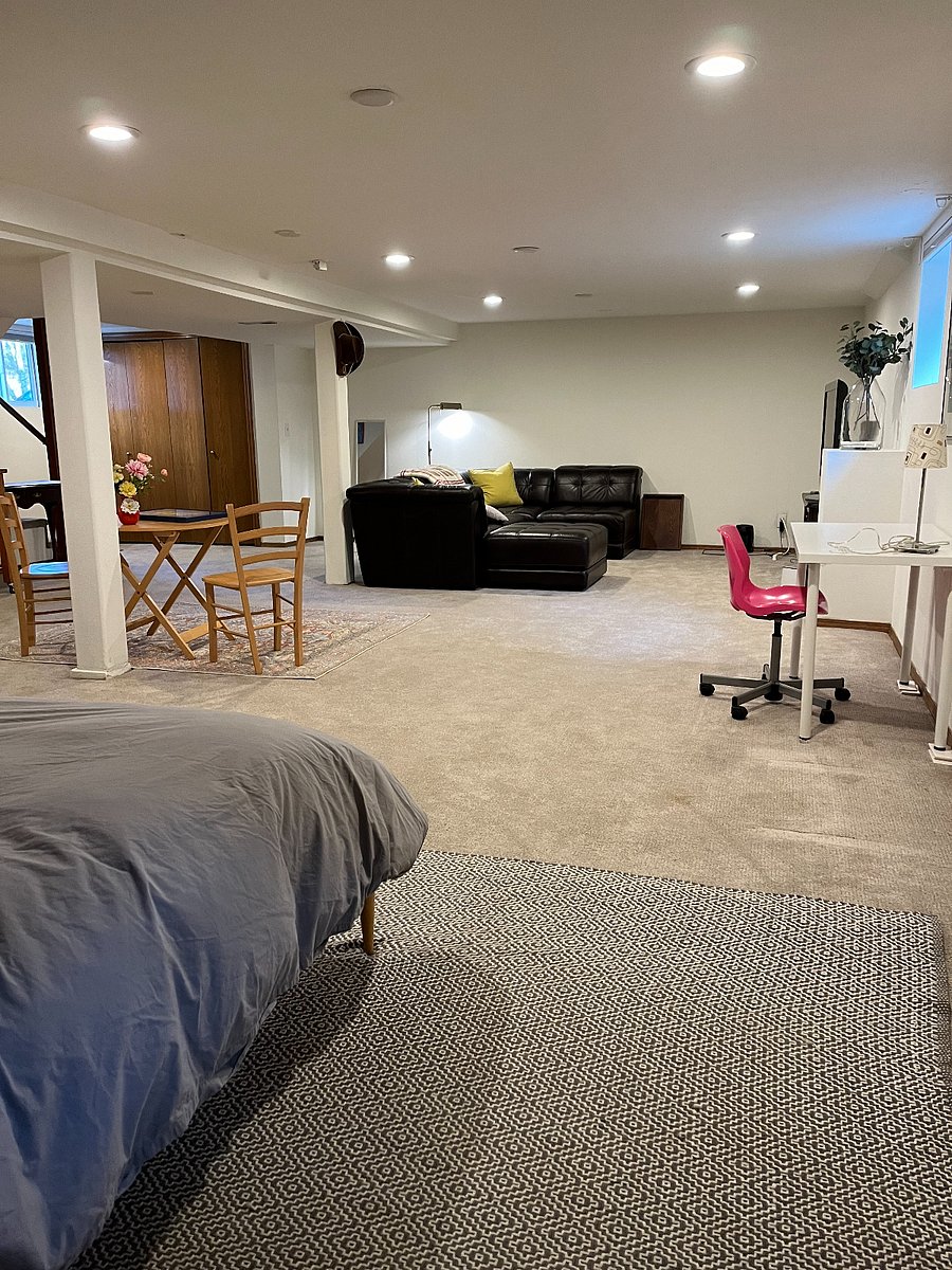 view from bedroom to living area with big TV and all the cable you could ever want.