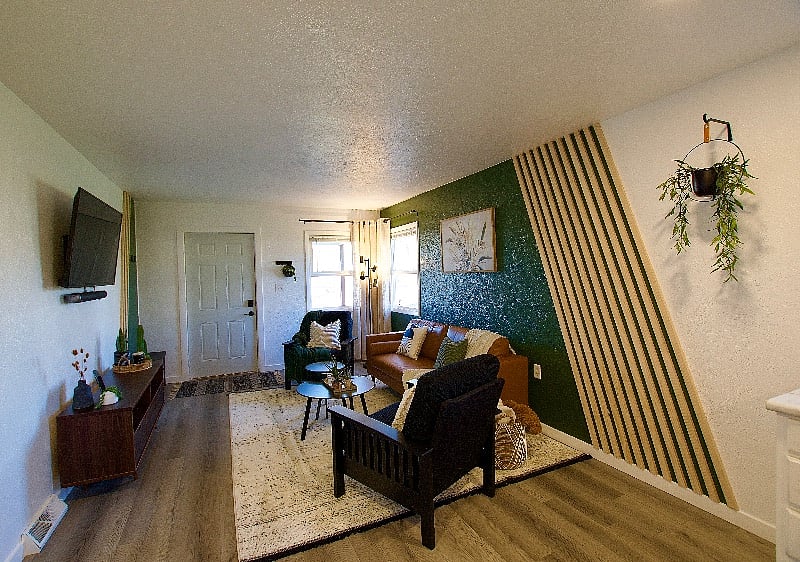 The living room is a cozy space to read a book or watch a movie.