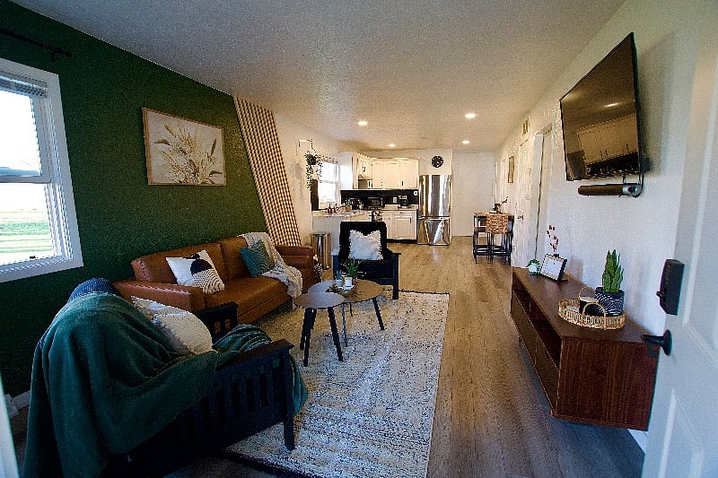 The view of the living room & kitchen from the front door.