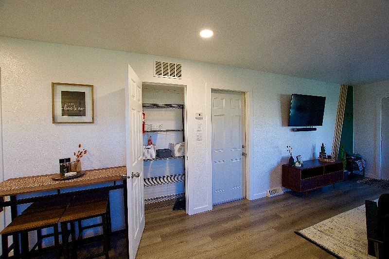 The pantry offers ample storage for food and paper products.