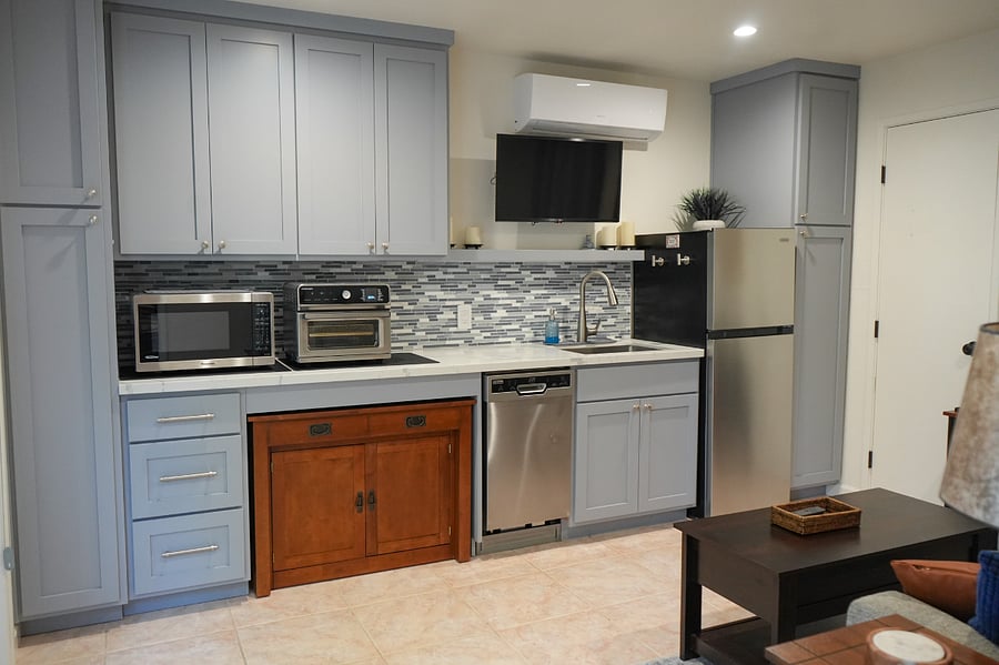 Kitchenette includes dishwasher, full size refrigerator, microwave, air fryer/toaster oven, Ninja blender, coffee pot, electric tea pot, electric skillet and boiling pot, all the dishes and kitchen supplies you will need + lots of cupboard space!