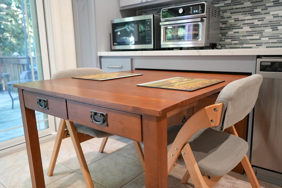 Expanding cabinet/table and two comfy folding chairs. This table expands to seating for more if you are having friends over for dinner. Extra chairs are available. 