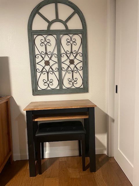 Cute table with shelf and bench that can serve as a desk and/or vanity.