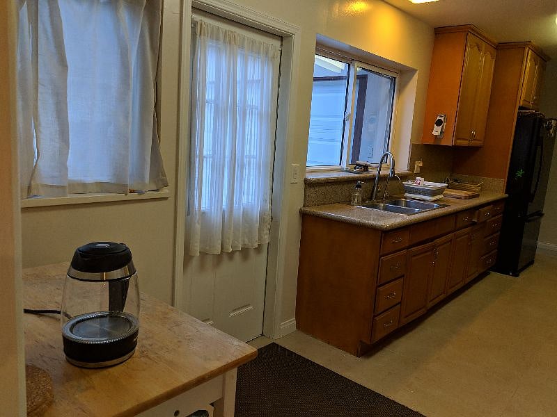 Galley style kitchen with entrance to the driveway.