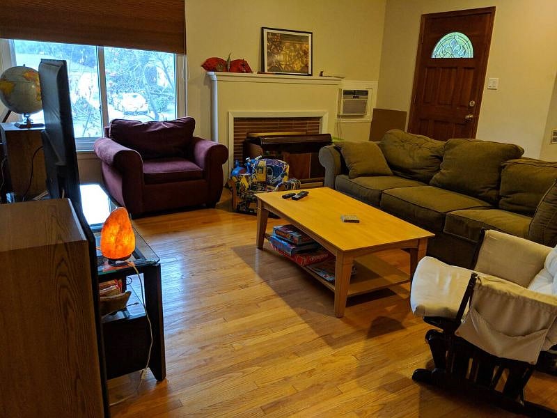 Spacious living room with a large screen TV connected to high-end speakers.