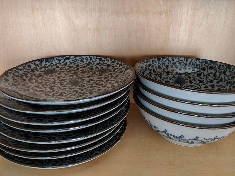 Plenty of plates, bowls, silverware, cooking supplies and everything else you need.