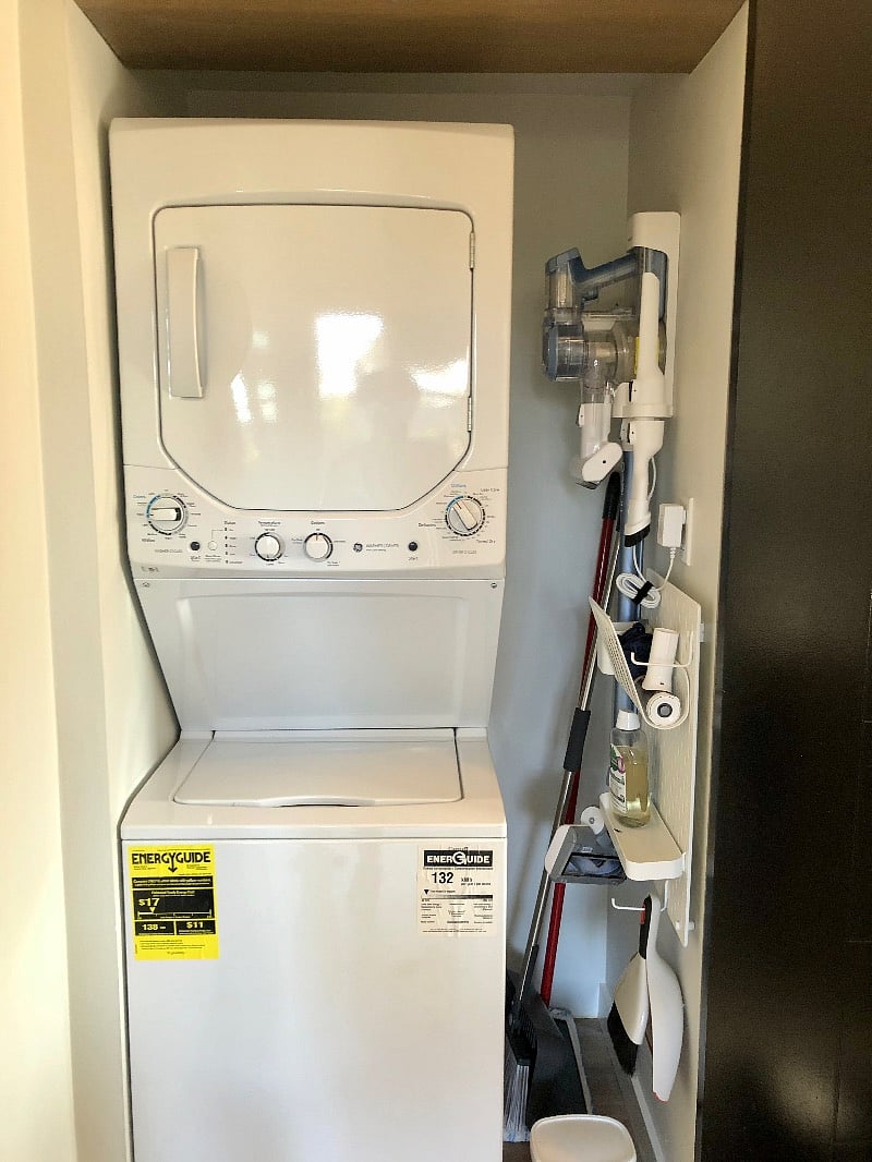 Brand new washer + dryer unit, wireless vacuum, and broom closet