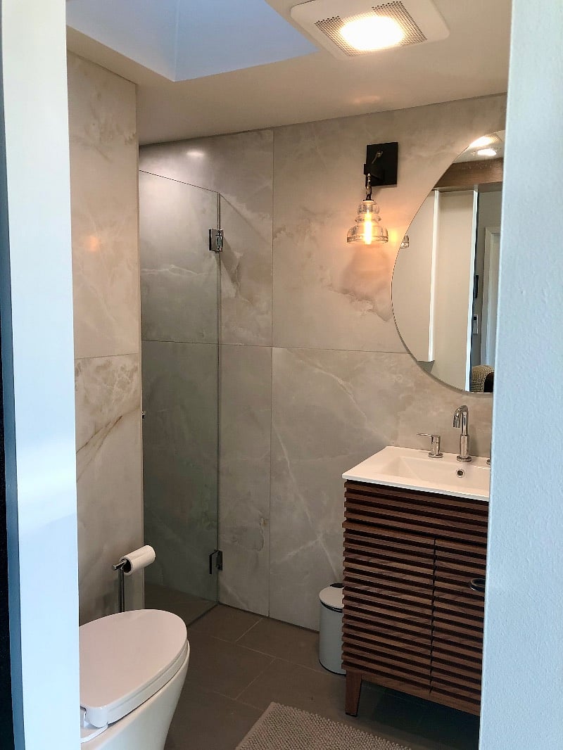 Tiled bathroom with stall shower