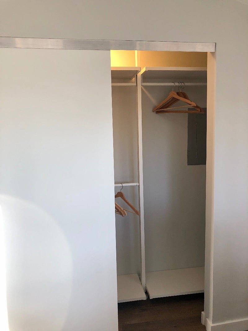 Bedroom built-in closet, side 2 (with access panel to fuse box)