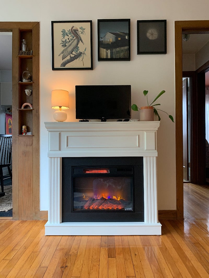 The electric fireplace keeps the living room warm and the vibes right.