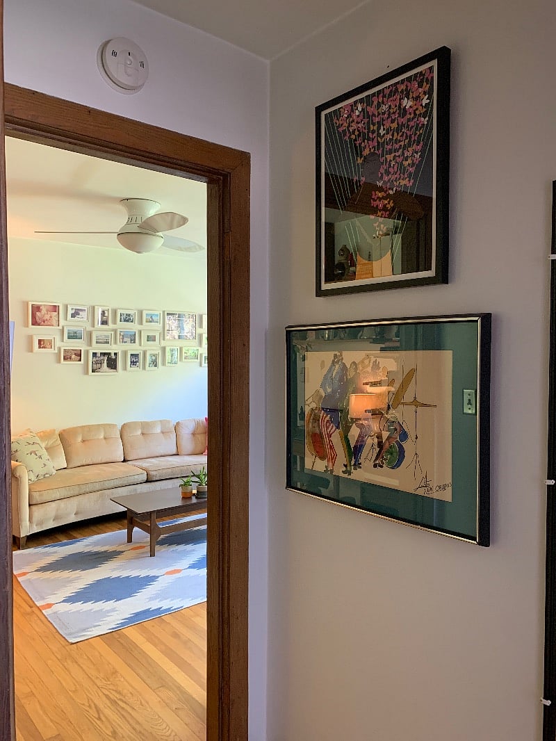 A view from the bedroom into the living room.  Vintage print from New Orleans and original art by Bethlehem Shoals. 