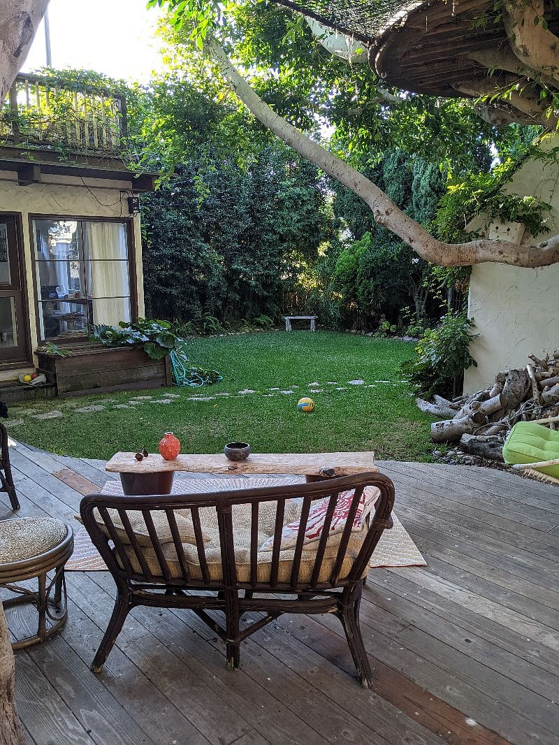 Large fenced in backyard with room for dog (or human) to run and relax. Surf shower along side of house.