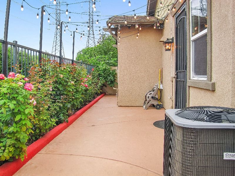 Backyard with BBQ and string lights for relaxing evenings