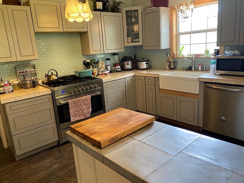 The kitchen is beautiful with modern upgrades, but still retaining farmhouse charm