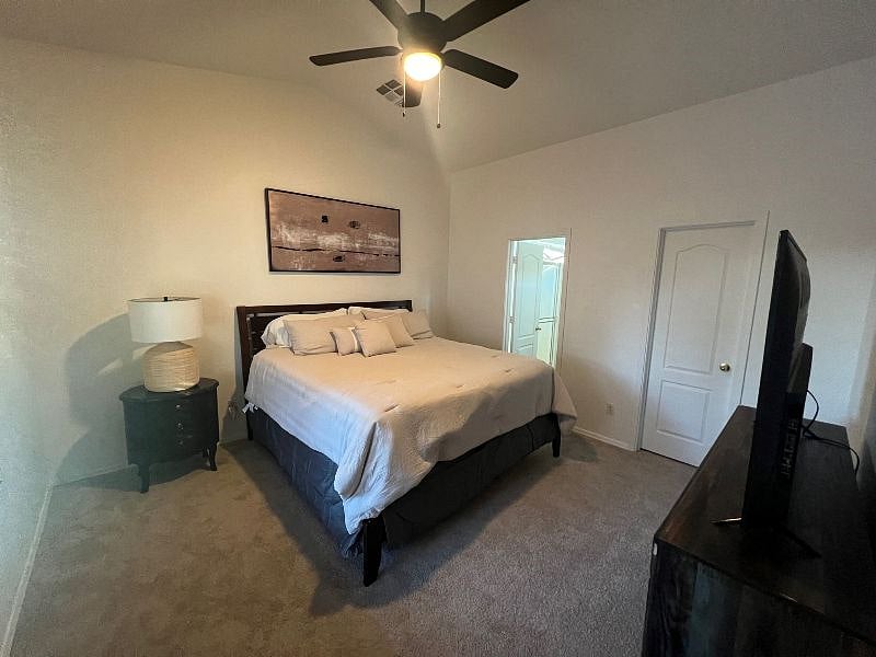 King Master Bedroom with 60" smart tv, walk-in closet
