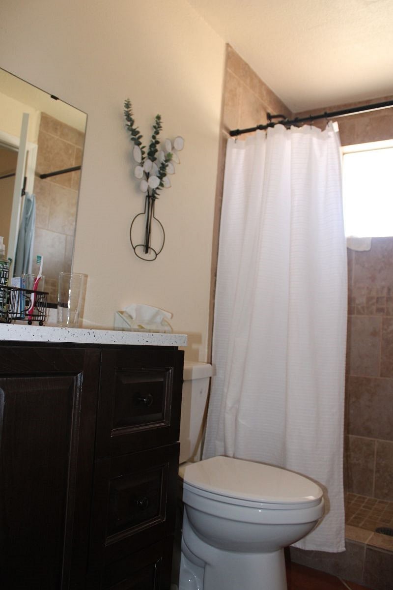 Large tile shower with good hot water and laundry basket (not shown) for your use.