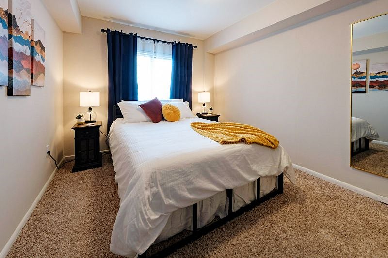 Bedroom with comfy memory foam mattress and luxurious sheets and down comforter. Both nightstands have outlets and USB ports built in for your convenience.