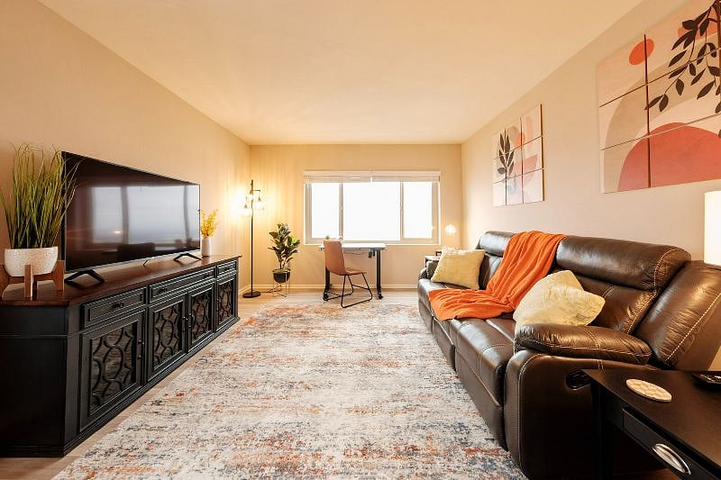 Your comfortable living room with lots of natural light.