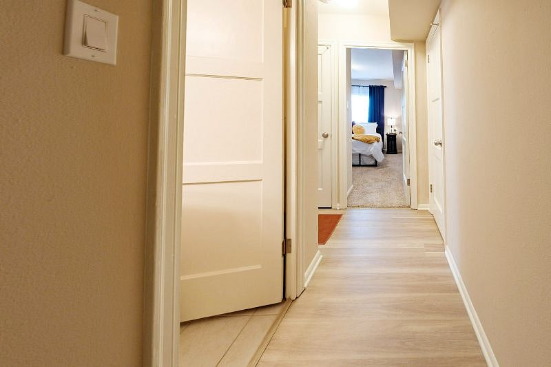 Entrance hallway leading to bedroom and bathroom.