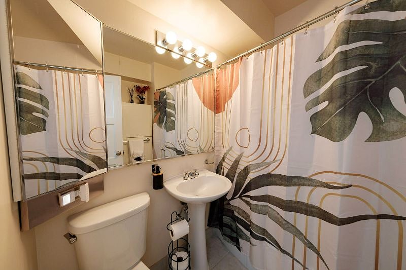 Bathroom with luxurious spa quality towels, wash cloths and special clothes for makeup removal.