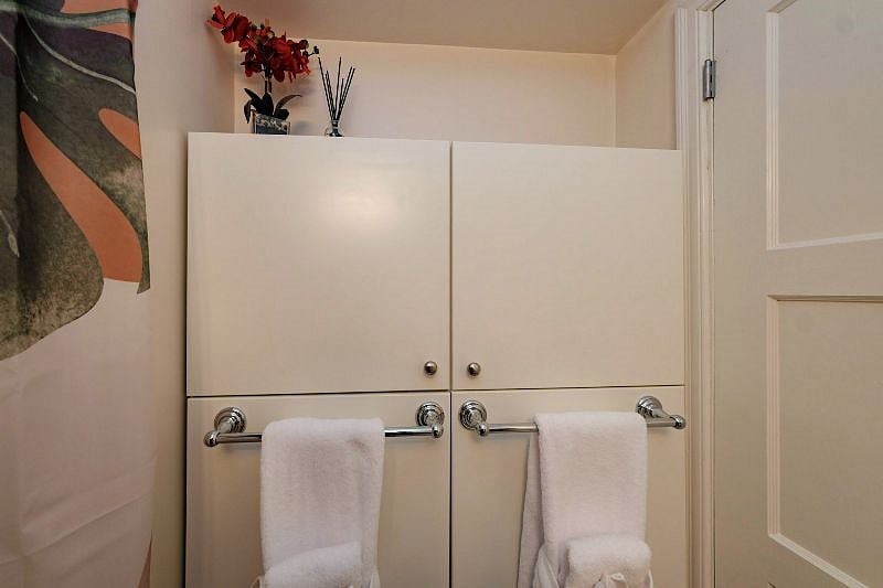 Bathroom has these built in cabinets and a medicine cabinet providing plenty of storage for your toiletries.