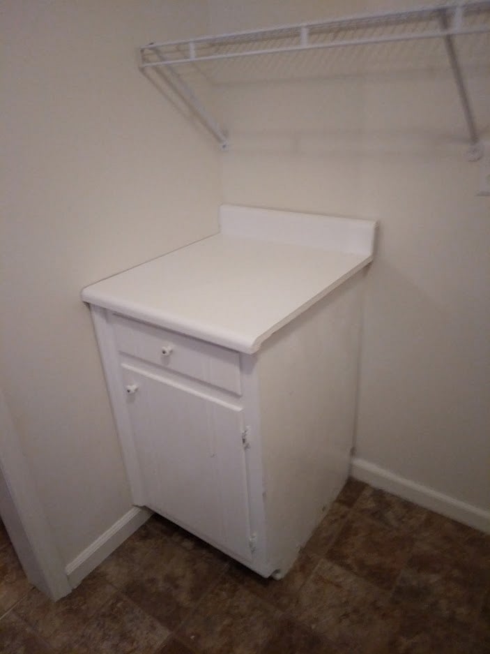 Cabinet in Laundry Room for folding laundry and storage.