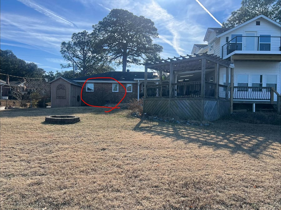 Back of home. Your bedroom and bathroom window circled in red.